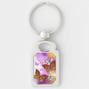Llavero Mariposas Monarca sobre Fondo Púrpura
