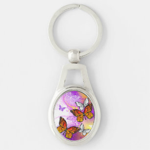 Llavero Mariposas monarcas en fondo morado