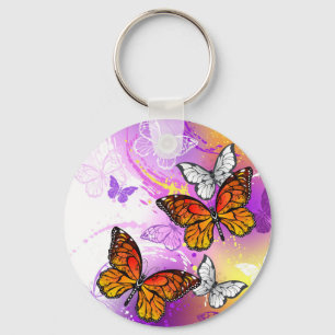 Llavero Mariposas monarcas en fondo morado