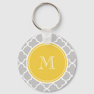 Llavero Modelo gris de Quatrefoil, monograma amarillo