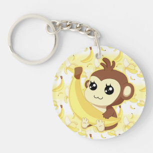 Llavero Mono lindo de Kawaii que sostiene el plátano