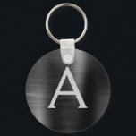 Llavero Monograma de acero inoxidable negro moderno Faux<br><div class="desc">Moderno y elegante Black Faux Stainless Steel Metallic Elegant Keychain. Estas cadenas de claves se pueden personalizar para incluir su nombre inicial y su nombre de pila. Estas cadenas de claves hacen grandes favores de cumpleaños,  ducha de novia o fiesta de soltera.</div>