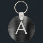 Llavero Monograma de acero inoxidable negro moderno Faux<br><div class="desc">Moderno y elegante Black Faux Stainless Steel Metallic Elegant Keychain. Estas cadenas de claves se pueden personalizar para incluir su nombre inicial y su nombre de pila. Estas cadenas de claves hacen grandes favores de cumpleaños,  ducha de novia o fiesta de soltera.</div>