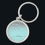 Llavero Monograma de purpurina plateada y azul teal<br><div class="desc">Cadenas de monograma con nombre en guión con purpurina brillante azul teal y plateada. Esto hace que el regalo perfecto para cumpleaños número 16,  boda,  ducha de novia,  aniversario,  ducha de bebé o fiesta de despedida de soltera para alguien que ama el glamour de lujo y los estilos chic.</div>