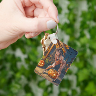 Llavero Monstruo de Halloween Jack-o-Lantern y chica Vixen