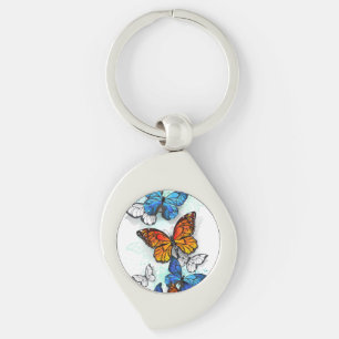 Llavero Morfo y monarca de las mariposas voladoras