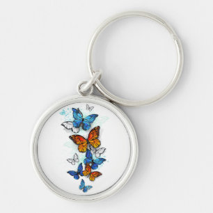 Llavero Morfo y monarca de las mariposas voladoras