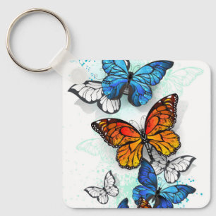 Llavero Morfo y monarca de las mariposas voladoras