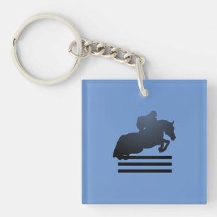 Llavero Mostrar saltador limpiando un obstáculo.