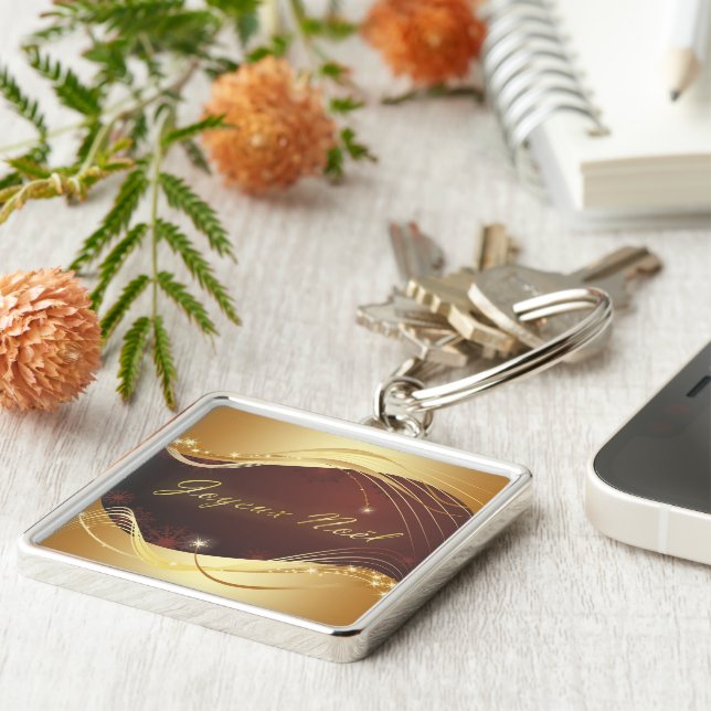 Llavero Motivo de Navidades dorados con fondo rojo... (Lado)