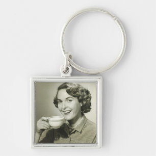 Llavero Mujer que sostiene las tazas