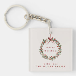 Llavero Navidades de follaje coronaron con arco rojo.