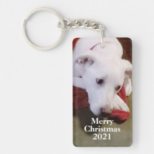 Llavero Navidades de perros blancos y nevados rojos