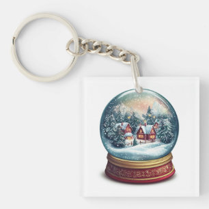 Llavero Navidades Nieve globo con un diseño de pueblo pequ