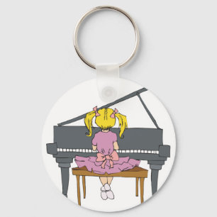 Llavero niña pequeña tocando piano