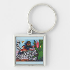 Llavero niño fantasía montando gato luchando con dragón y