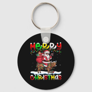 Llavero Nochebuena alumbrando Santa Riding Cow Feliz Navid