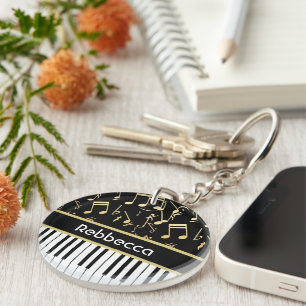 Llavero Notas musicales y claves de piano negro y oro