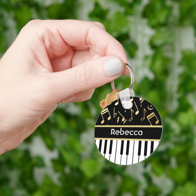 Llavero Notas musicales y claves de piano negro y oro (Mano)