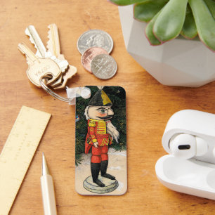 Llavero Nutcracker de época bajo árbol de Navidad