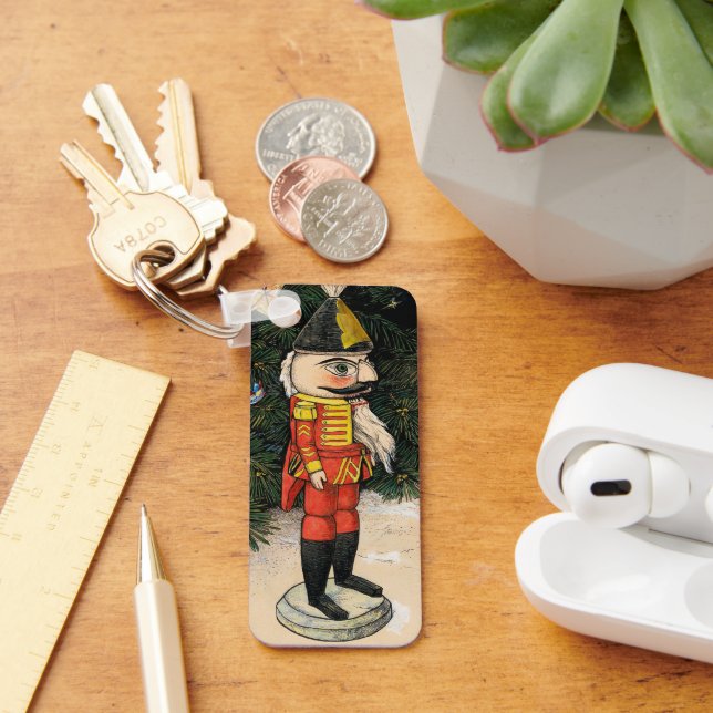 Llavero Nutcracker de época bajo árbol de Navidad (Escritorio )