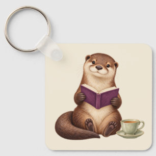 Llavero Nutria acogedora leyendo con libro morado y té