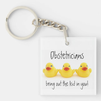 Llavero Obstetricistas y pollos de caucho amarillos