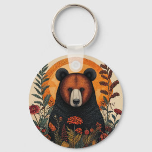 Llavero Oso artístico entre flores botánicas vibrantes