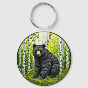 Llavero Oso negro en un bosque de abedules