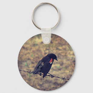 Llavero Pajarito rojo en alambre de púas