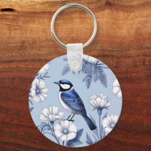 Llavero Pájaro Azul Elegante y Patrón Floral Blanco