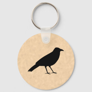 Llavero Pájaro negro del cuervo en un modelo del pergamin