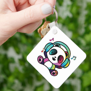 Llavero Panda feliz con auriculares escuchando música.