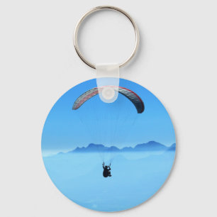 Llavero Parapente con fondo azul con montañas