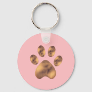Llavero Pata de mascota marrón linda sobre rosa