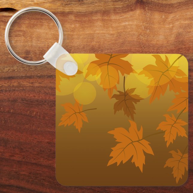 Llavero Patrón otoñal con hojas de arce en caída y bokeh (Anverso)