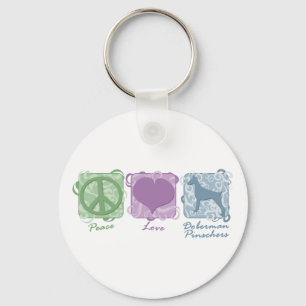 Llavero Paz, amor, y Pinschers en colores pastel del