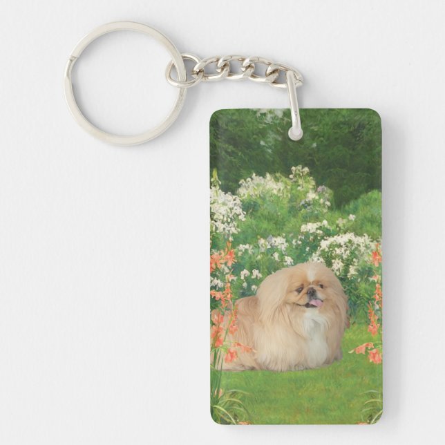 Llavero Pekingeses en un jardín (Frente)