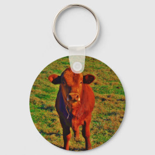 Llavero Pequeña vaca marrón brillante hierba verde