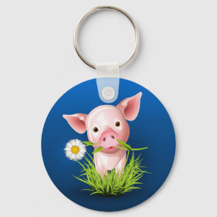 Llavero Pequeño cerdo rosado con hierba verde sobre azul