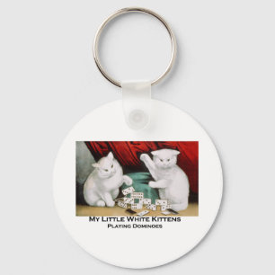 Llavero Pequeños gatitos blancos que juegan dominós