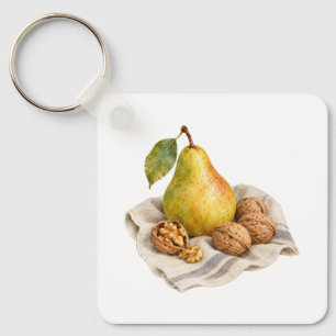Llavero Pera y nueces sobre un paño de lino