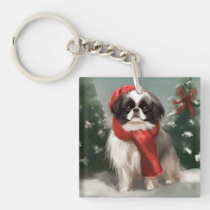 Llavero Perro Chin Japonés en Navidad con nieve
