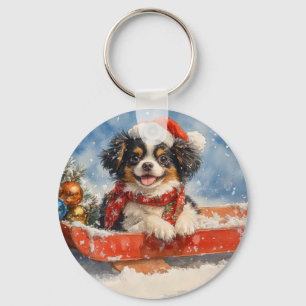 Llavero Perro Chin Japonés en Trineo Deja que Nieve Navida