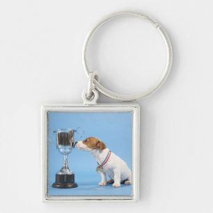 Llavero Perro con el trofeo