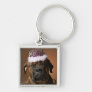 Llavero Perro con la corona del cumpleaños en la cabeza