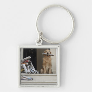 Llavero Perro del golden retriever que se sienta en la