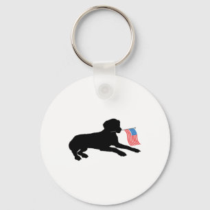 Llavero Perro labrador negro sosteniendo la bandera patrió