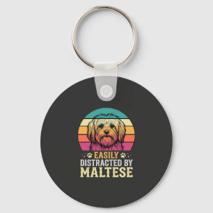 Llavero Perro maltés distraído en puesta de sol retro