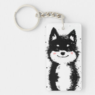 Llavero Perro negro y blanco sonriendo